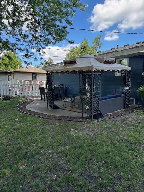 5025 Wilshire Blvd, Crystal, MN 55429 - rear view of property with a patio area