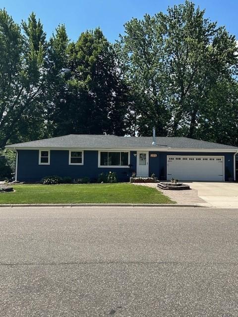 5025 Wilshire Blvd, Crystal, MN 55429 - ranch-style home featuring a front yard, concrete driveway, and a garage