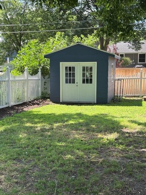 5025 Wilshire Blvd, Crystal, MN 55429 - view of shed featuring a fenced backyard