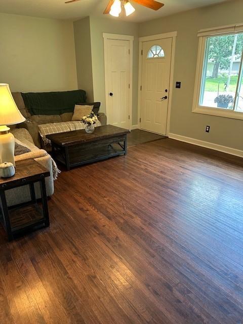 5025 Wilshire Blvd, Crystal, MN 55429 - living area featuring ceiling fan and dark wood finished floors