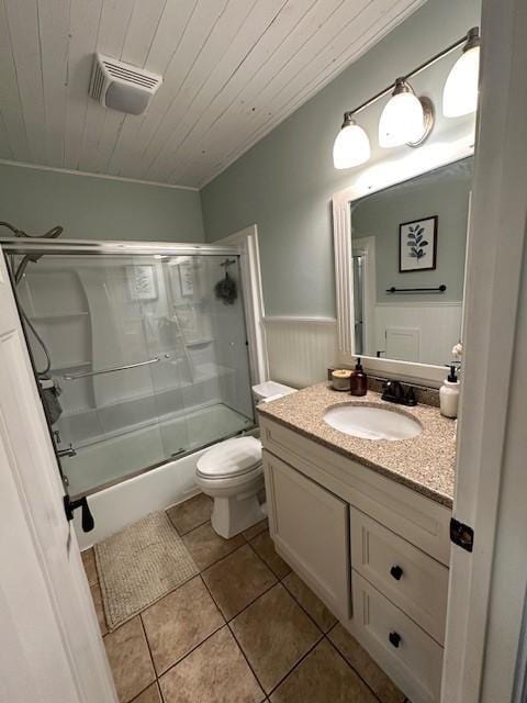 5025 Wilshire Blvd, Crystal, MN 55429 - full bath featuring vanity, a wainscoted wall, tile patterned flooring, wood ceiling, and bath / shower combo with glass door