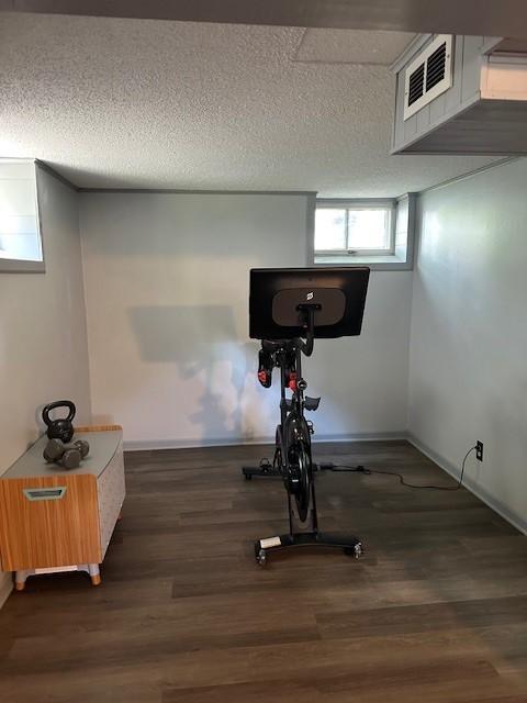 5025 Wilshire Blvd, Crystal, MN 55429 - exercise area featuring a textured ceiling and wood finished floors