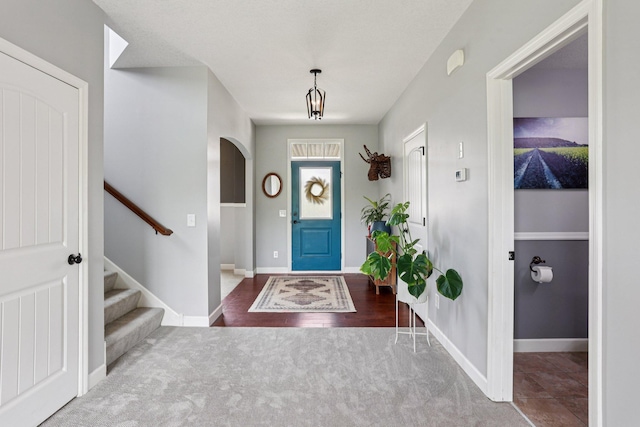 6287 Fountain Ln N, Maple Grove, MN 55311 - foyer with carpet, arched walkways, and stairway