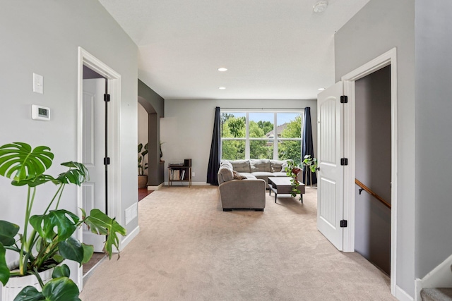 6287 Fountain Ln N, Maple Grove, MN 55311 - living area featuring light carpet, arched walkways, and recessed lighting