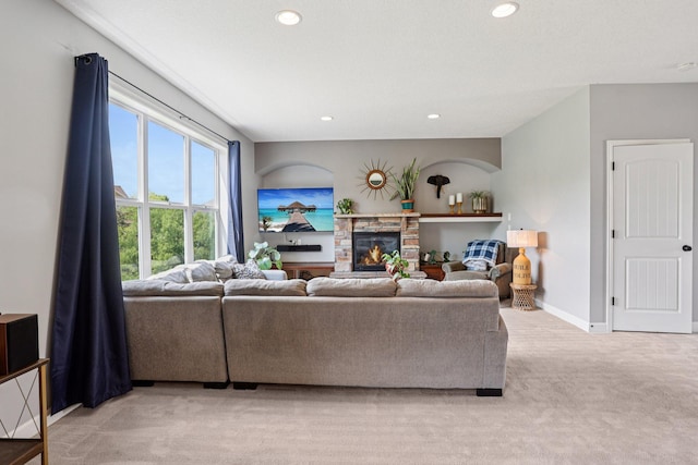 6287 Fountain Ln N, Maple Grove, MN 55311 - living room featuring light colored carpet, recessed lighting, and a stone fireplace