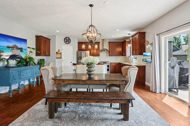 6287 Fountain Ln N, Maple Grove, MN 55311 - dining space with light wood-type flooring, a chandelier, and recessed lighting