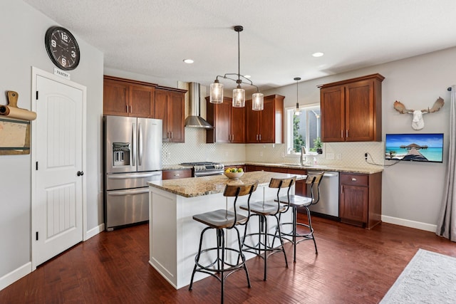 6287 Fountain Ln N, Maple Grove, MN 55311 - kitchen with appliances with stainless steel finishes, wall chimney exhaust hood, tasteful backsplash, light stone counters, and dark wood-type flooring