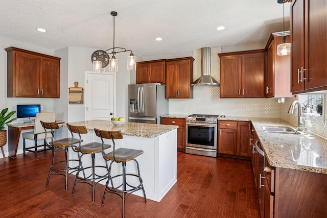 6287 Fountain Ln N, Maple Grove, MN 55311 - kitchen featuring appliances with stainless steel finishes, wall chimney range hood, a kitchen bar, dark wood-style flooring, and light stone countertops