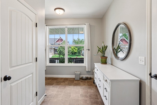 6287 Fountain Ln N, Maple Grove, MN 55311 - doorway featuring baseboards