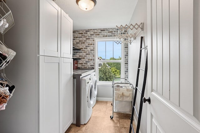 6287 Fountain Ln N, Maple Grove, MN 55311 - laundry area with cabinet space, washer and clothes dryer, and light tile patterned flooring