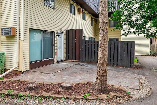 7248 72nd Ln N, Brooklyn Park, MN 55428 - view of patio / terrace with a wall mounted air conditioner