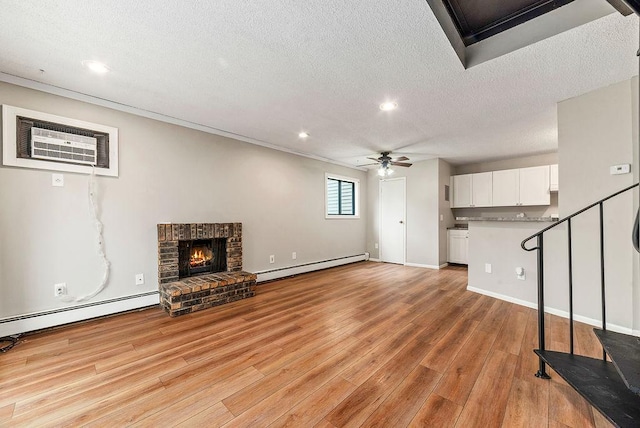 7248 72nd Ln N, Brooklyn Park, MN 55428 - unfurnished living room with a baseboard radiator, ceiling fan, a textured ceiling, light wood-style floors, and recessed lighting
