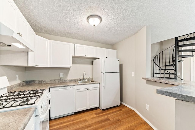 7248 72nd Ln N, Brooklyn Park, MN 55428 - kitchen with white appliances, light wood-type flooring, white cabinets, a textured ceiling, and custom range hood
