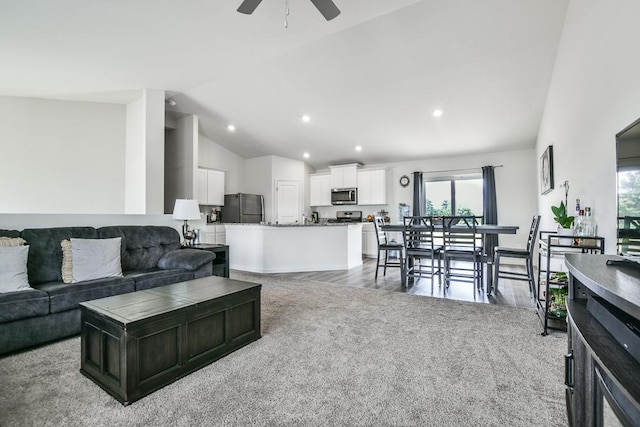 39604 Fallbrook Ave, North Branch, MN 55056 - living area featuring lofted ceiling, ceiling fan, carpet floors, and recessed lighting