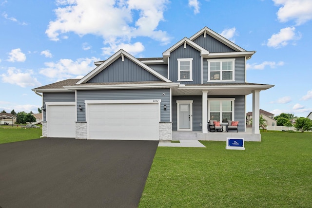 7249 Large Ave NE, Otsego, MN 55301 - craftsman inspired home featuring covered porch, board and batten siding, driveway, and a front lawn