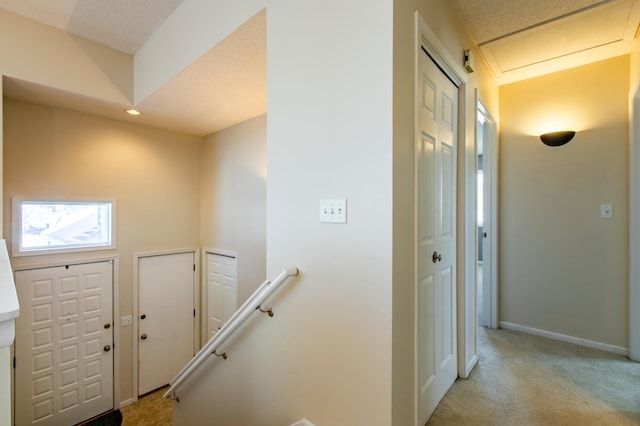 602 Cortland Ln SW, Rochester, MN 55902 - foyer entrance with light carpet and recessed lighting