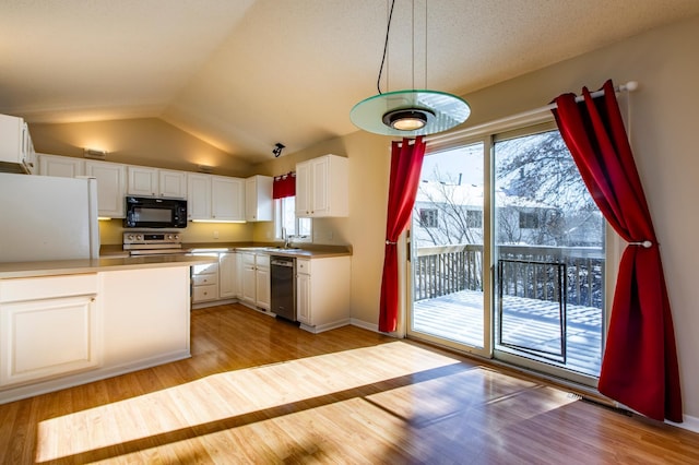 602 Cortland Ln SW, Rochester, MN 55902 - kitchen with appliances with stainless steel finishes, healthy amount of natural light, light wood finished floors, white cabinets, and lofted ceiling