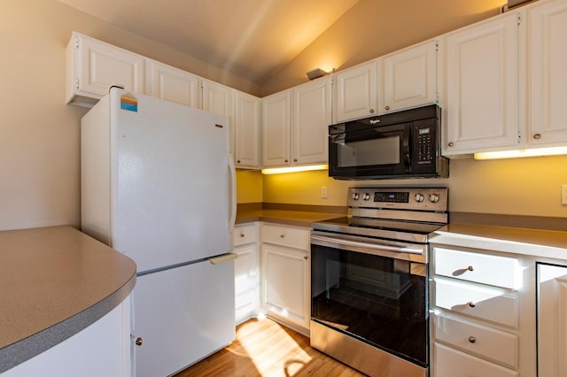 602 Cortland Ln SW, Rochester, MN 55902 - kitchen with stainless steel electric range, freestanding refrigerator, black microwave, lofted ceiling, and light wood-style flooring