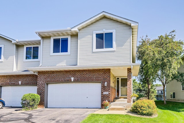 15126 Cimarron Way, Rosemount, MN 55068 - traditional-style home with an attached garage, brick siding, and driveway