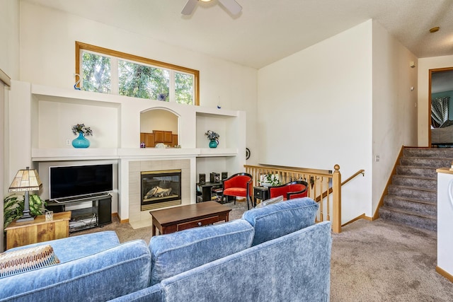 15126 Cimarron Way, Rosemount, MN 55068 - living area featuring carpet, ceiling fan, a tile fireplace, and stairway