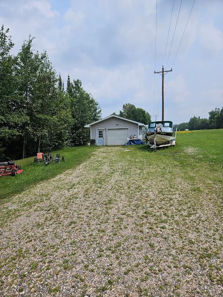 2742 State Highway 11 SE, Gudrid Twp, MN 56623 - view of grassy yard featuring a detached garage