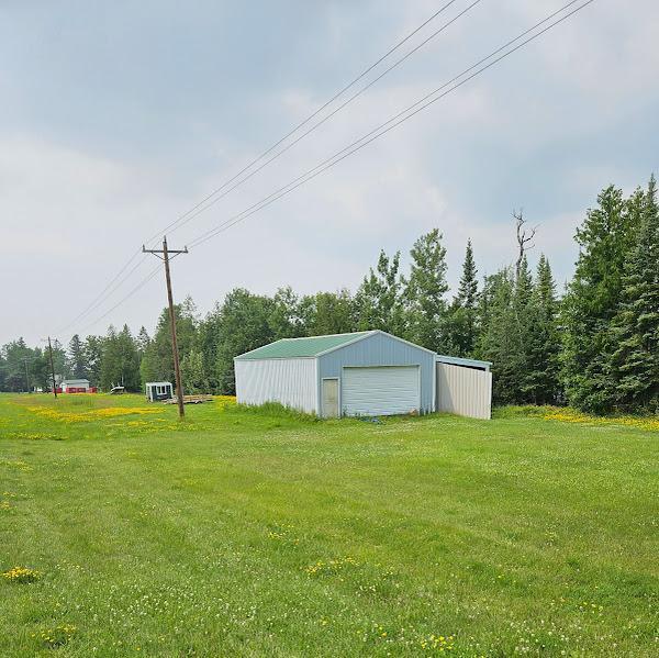 2742 State Highway 11 SE, Gudrid Twp, MN 56623 - view of green lawn featuring a garage and an outbuilding