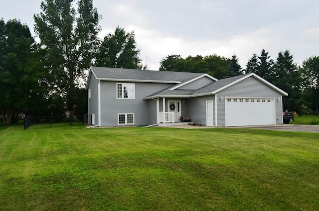 1120 Madisson St, Alexandria, MN 56308 - split level home with an attached garage, asphalt driveway, and roof with shingles