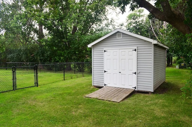 1120 Madisson St, Alexandria, MN 56308 - view of shed featuring a gate