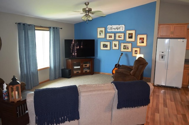 1120 Madisson St, Alexandria, MN 56308 - living area featuring ceiling fan, wood finished floors, and vaulted ceiling