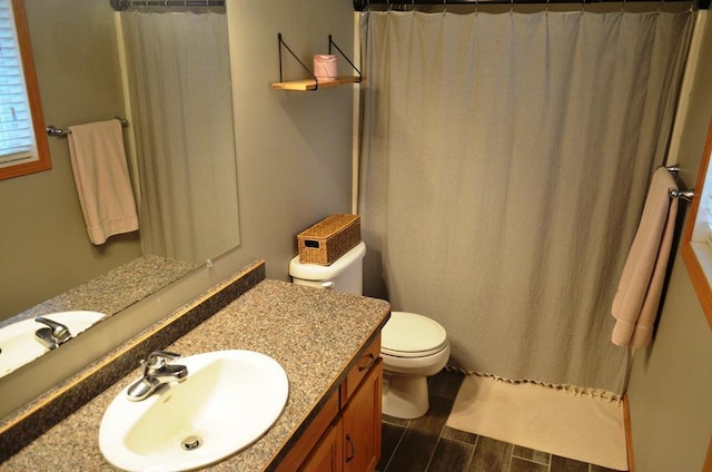 1120 Madisson St, Alexandria, MN 56308 - bathroom featuring vanity, wood finished floors, and a shower with curtain