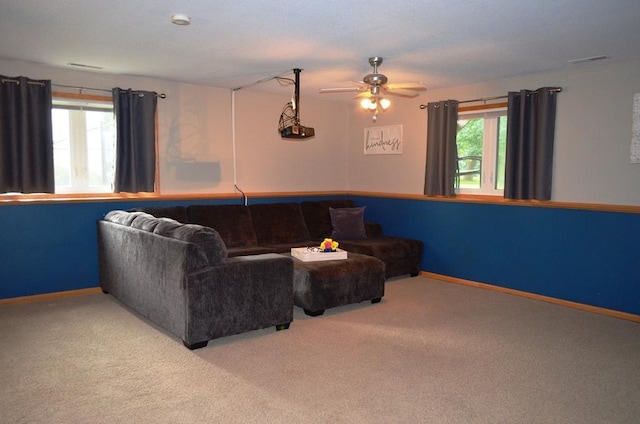 1120 Madisson St, Alexandria, MN 56308 - living room with healthy amount of natural light, carpet floors, and a ceiling fan