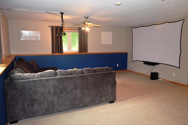 1120 Madisson St, Alexandria, MN 56308 - carpeted home theater featuring a ceiling fan and baseboards