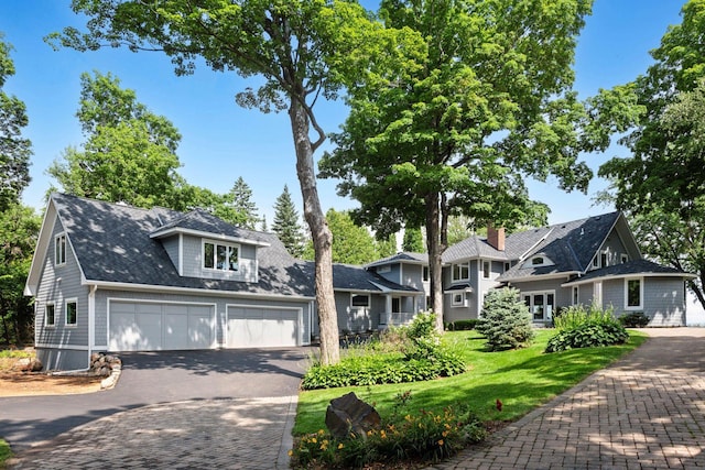 2462 Lafayette Rd, Minnetonka Beach, MN 55391 - shingle-style home with driveway, an attached garage, and a front lawn