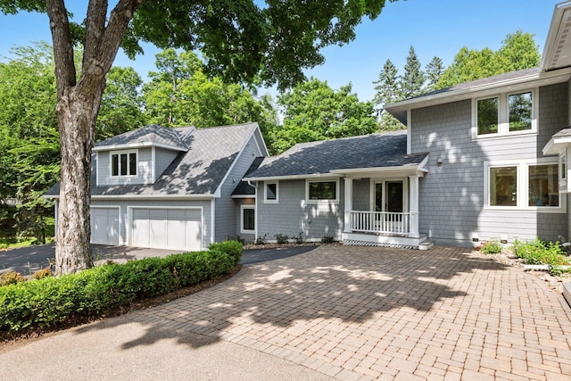 2462 Lafayette Rd, Minnetonka Beach, MN 55391 - view of front of home with driveway, a shingled roof, and an attached garage