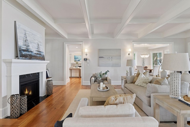 2462 Lafayette Rd, Minnetonka Beach, MN 55391 - living room featuring light wood-style flooring, beamed ceiling, coffered ceiling, and a high end fireplace