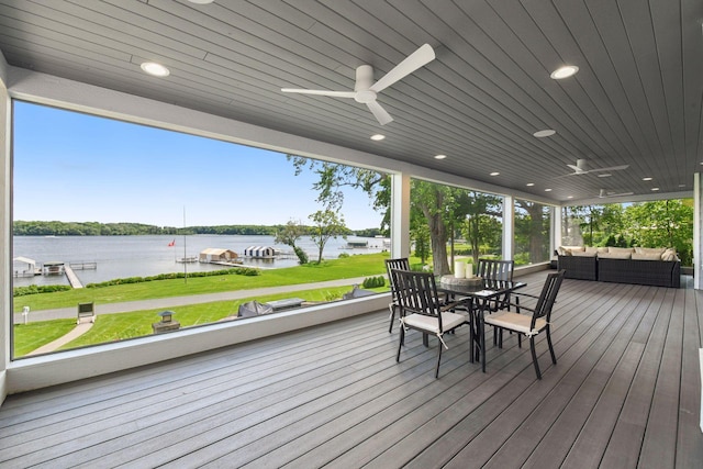 2462 Lafayette Rd, Minnetonka Beach, MN 55391 - wooden deck featuring a water view, ceiling fan, outdoor dining space, a lawn, and outdoor lounge area