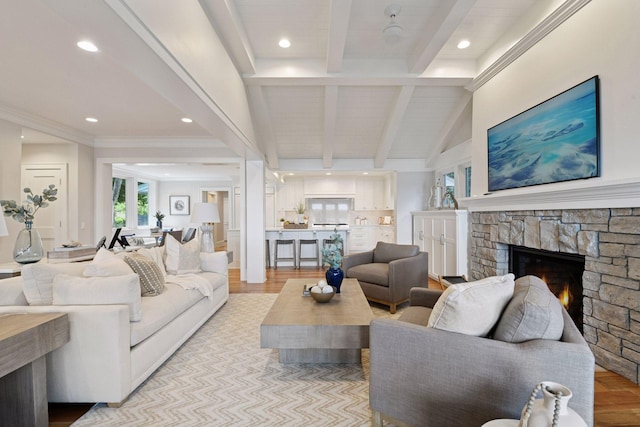 2462 Lafayette Rd, Minnetonka Beach, MN 55391 - living area featuring beamed ceiling, healthy amount of natural light, a stone fireplace, recessed lighting, and light wood finished floors