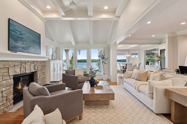 2462 Lafayette Rd, Minnetonka Beach, MN 55391 - living area featuring a fireplace, healthy amount of natural light, a water view, recessed lighting, and wooden ceiling