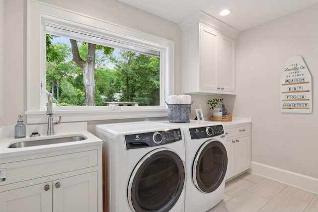 2462 Lafayette Rd, Minnetonka Beach, MN 55391 - laundry area featuring cabinet space, washing machine and dryer, and recessed lighting