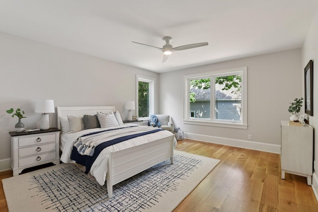 2462 Lafayette Rd, Minnetonka Beach, MN 55391 - bedroom with light wood-style floors and ceiling fan