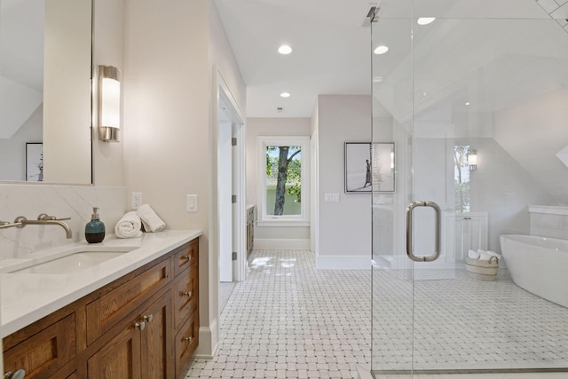 2462 Lafayette Rd, Minnetonka Beach, MN 55391 - full bathroom featuring vanity, a freestanding bath, a stall shower, and recessed lighting