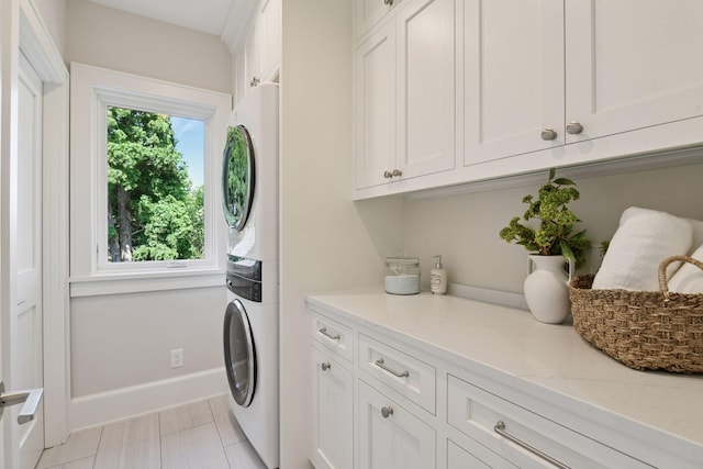 2462 Lafayette Rd, Minnetonka Beach, MN 55391 - laundry area featuring stacked washer / dryer and cabinet space