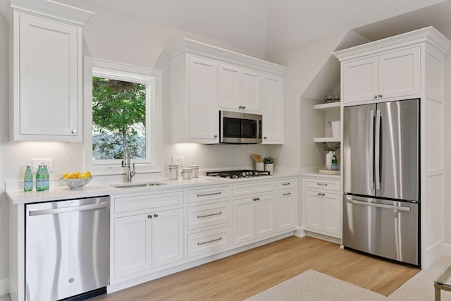 2462 Lafayette Rd, Minnetonka Beach, MN 55391 - kitchen featuring stainless steel appliances, light wood-type flooring, white cabinets, light countertops, and open shelves