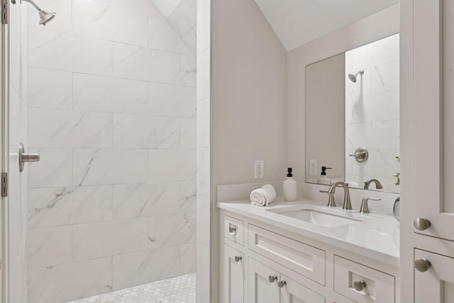 2462 Lafayette Rd, Minnetonka Beach, MN 55391 - bathroom with a tile shower, vanity, and lofted ceiling