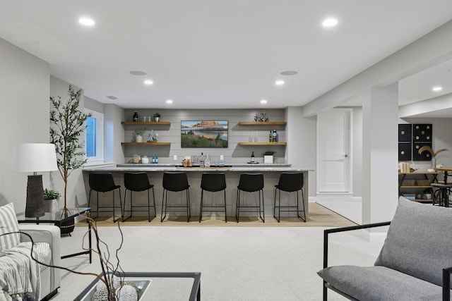 2462 Lafayette Rd, Minnetonka Beach, MN 55391 - living area with bar with sink, recessed lighting, and light wood-type flooring