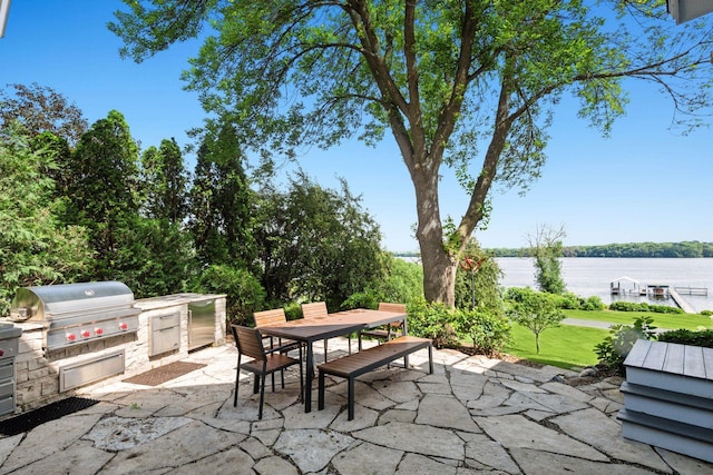 2462 Lafayette Rd, Minnetonka Beach, MN 55391 - view of patio / terrace featuring an outdoor kitchen, outdoor dining area, and a water view