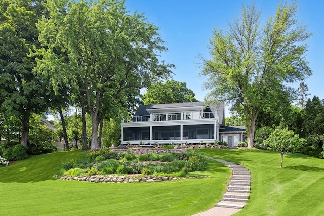 2462 Lafayette Rd, Minnetonka Beach, MN 55391 - rear view of property featuring a sunroom and a lawn