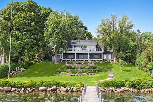 2462 Lafayette Rd, Minnetonka Beach, MN 55391 - rear view of property with a balcony, a yard, a sunroom, and a water view