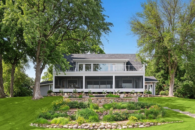 2462 Lafayette Rd, Minnetonka Beach, MN 55391 - rear view of house with a sunroom, a yard, roof with shingles, and a balcony