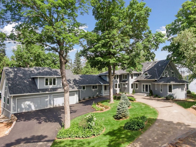 2462 Lafayette Rd, Minnetonka Beach, MN 55391 - view of front of house featuring driveway and a shingled roof